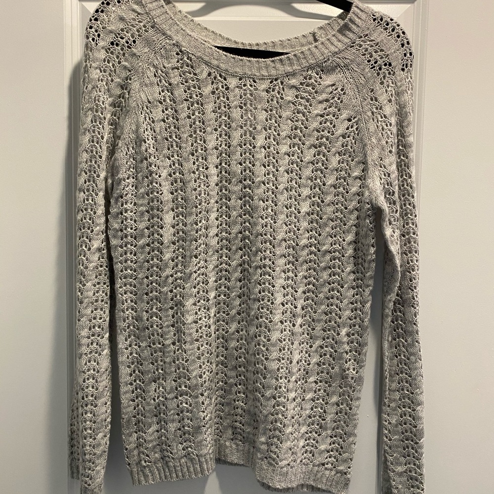 dELiA’s knit sweater with sparkly bows down back
